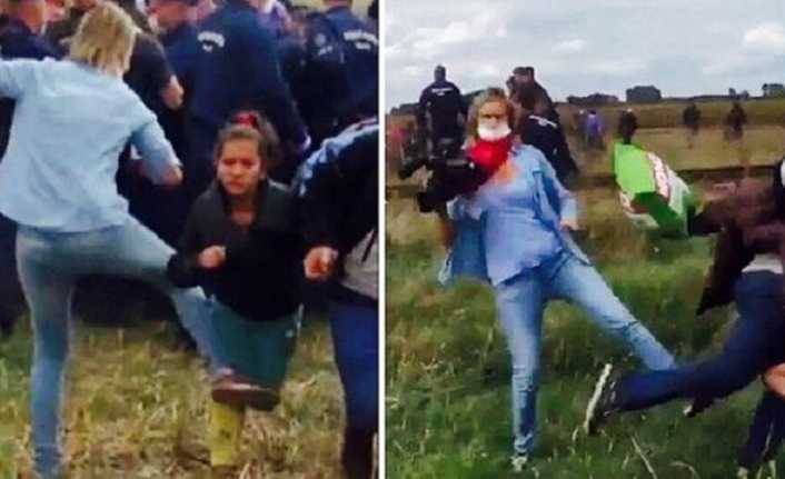 Macaristan-Sırbistan sınırından ülkeye girişi sırasında oğlunu sırtında taşıyarak polislerden kaçmaya